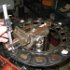 The coil frame is mounted to the engine block but must be adjusted to be at the correct distance and parallel to the plane of the crankshaft flange. Here a 3/4” square steel tube bolted the the crank flange and a digital caliper are used to measure the distance to the coils at 90 degree intervals. Selected shims are placed between the block and the coil frame, another tedious trial-and-error process that eventually gets it put right.