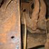 This is a view looking forward with the clutch and brake lever mounting bracket unbolted from the frame. There is some rust through of the body sub-rail. The unappealing grime and scale along with  the mouse droppings and acorn shells make this a pretty picture.