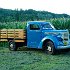 Another  view of the truck. Note the replica WWII gas rationing sticker on the windshield and the patriotic 48 star flag license plate topper on the vintage farm plate.