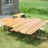 These varnished boards drying in the sun will become the stake sides for the bed.